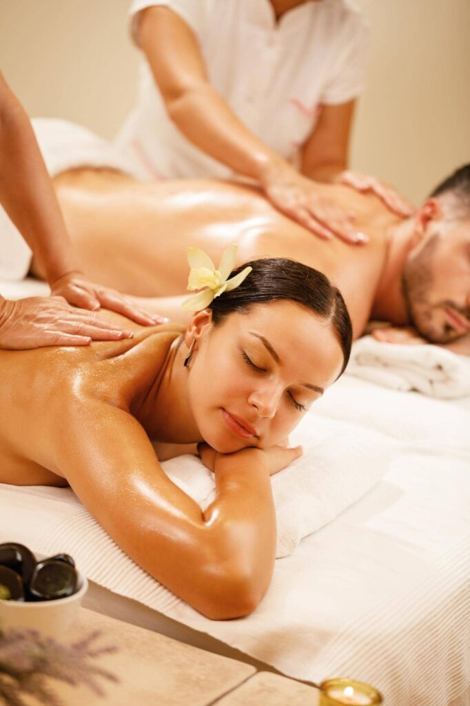 young couple relaxing during back massage health spa focus is young woman -